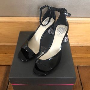 Heeled sandals, glossy black with snake skin heels.  Very cute. Never worn.